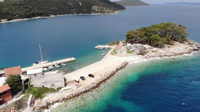 Spectacular footage of flying over picturesque fishing village.