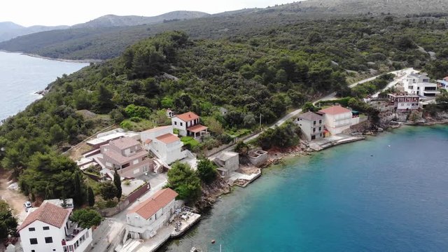 Spectacular footage of flying over picturesque fishing village.