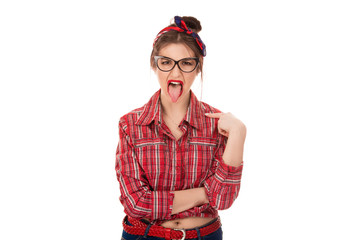 angry, young, childish rude bully woman sticking tongue out at camera