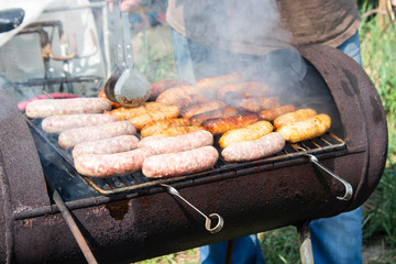 B-B-Q. Barbecue grill in the garden or in the backyard. Barbecue or picnic conceptual scene.