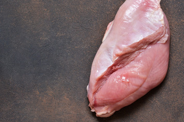 Raw turkey fillet and classic cooking spices. View from above.