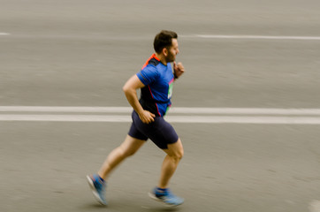 Fototapeta premium Man running fast like flash, motion blurred