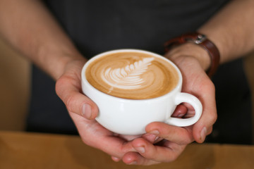 man holding a cup of coffee