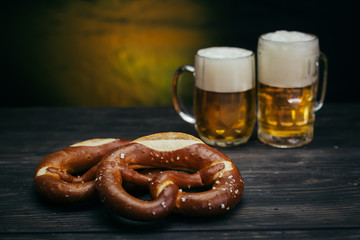 Pretzels and beer in mugs
