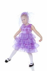 Little girl in purple dress.