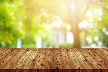 Emtry wooden table on top over blur natural background, can be used mock up for montage products display or design layout.