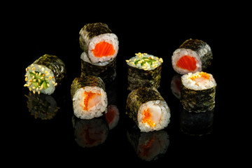 Set sushi roll. Traditional Japanese cuisine. Isolated on black background