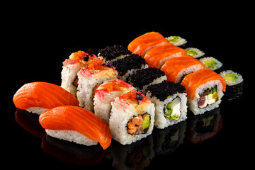 Set sushi roll. Traditional Japanese cuisine. Isolated on black background