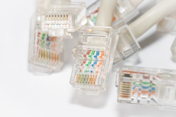 Close-up of many rj-45 connectors on isolated white background
