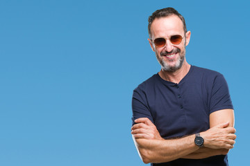Middle age hoary senior man wearing sunglasses over isolated background happy face smiling with...