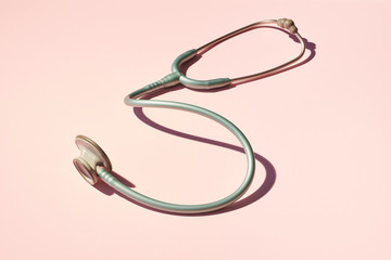 Stethoscope on Pink Background Table
