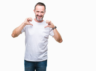 Middle age hoary senior man wearing white t-shirt over isolated background looking confident with smile on face, pointing oneself with fingers proud and happy.