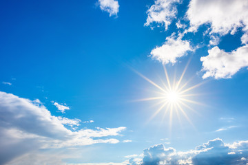 Naklejka na ściany i meble Summer background, wonderful blue sky with bright sun and clouds