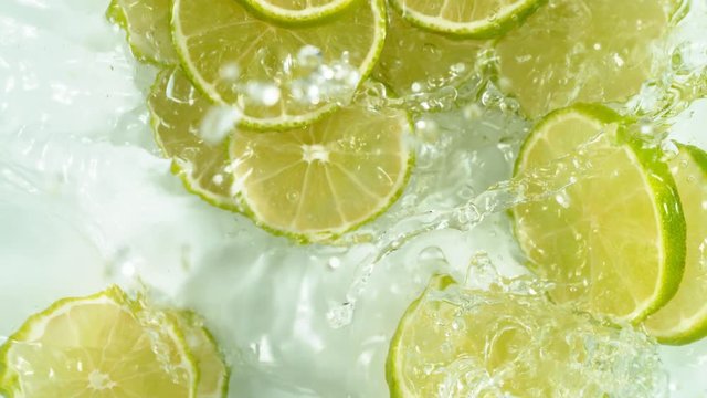 Super slow motion of falling lime slices into splashing water. Filmed on high speed cinema camera, 1000 fps.
