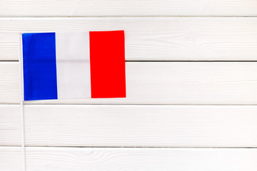 Independence Day of France concept with flag on white wooden background top view