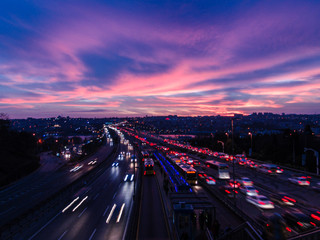 Busy traffic and city crowds at sunset