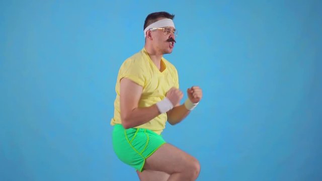 Funny man athlete from the 80's with a mustache makes the workout slow mo