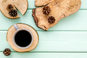 Tree stumps, coffee and cones for presentation background top view copy space
