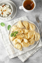 Dumplings, filled with cottage cheese. Russian, Ukrainian or Polish dish: varenyky, vareniki, pierogi, pyrohy.