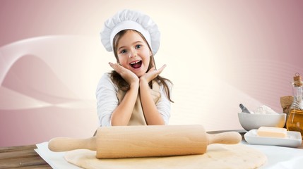 Portrait of adorable little girl preparing healthy food at kitchen
