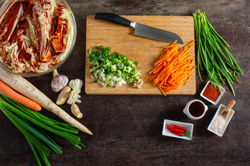 Preparing Kimchee with brightly colored ingredients. 