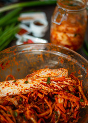 Preparing Kimchee with brightly colored ingredients. 