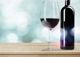 Red Wine in Bottle and Glass on white background