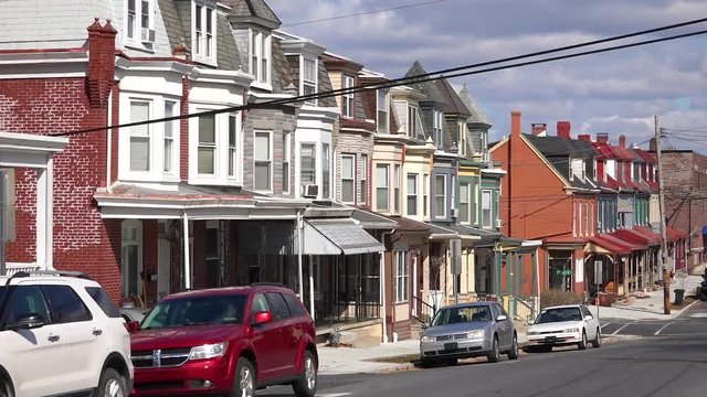 A residential street in Reading, Pennsylvania of rowhouses and homes in typical Pennsylvania style.