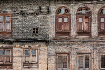 Abandoned building in old town Srinagar, Jammu and Kashmir, India. Ancient architecture buildings wooden window and the old brick wall houses at Srinagar is travel attraction 