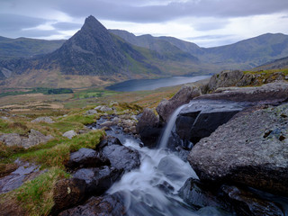 Tryfan in spring with the Afon Lloer in flow over the waterfalls, Wales.