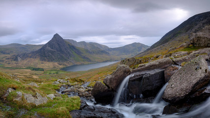 Tryfan in spring with the Afon Lloer in flow over the waterfalls, Wales.