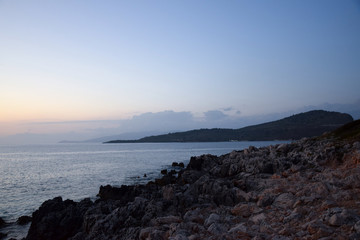 Golden hour Sundown, with view to Korfu island. Sunset on the beach in Ksamil near Saranda, Albania.