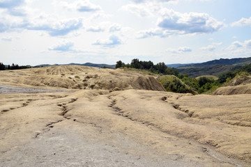 Dry, cracked earth near Mud Volcanoes (Vulcanii Noroiosi) in Berca. Buzau, Romania.