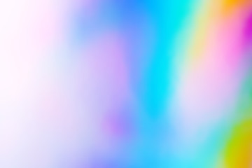 Blurry abstract iridescent holographic foil background.