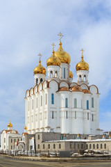 Holy Trinity Cathedral. Christian orthodox church. Beautiful large white building with golden domes and crosses. Russian Orthodox Church. Magadan, Siberia, Far East of Russia.