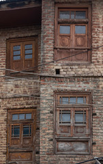 Abandoned building in old town Srinagar, Jammu and Kashmir, India. Ancient architecture buildings wooden window and the old brick wall houses at Srinagar is travel attraction