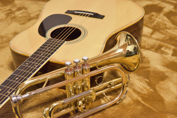 Fototapeta na wymiar a cornet and guitar on carpet