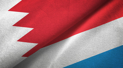 Fototapeta na wymiar Bahrain and Luxembourg two flags textile cloth, fabric texture