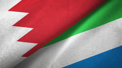 Fototapeta na wymiar Bahrain and Sierra Leone two flags textile cloth, fabric texture