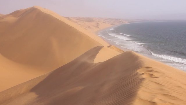 High winds blow across the amazing sand dunes of the Namib Desert along the Skeleton Coast of Namibia.