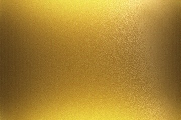 Light shining on golden foil metal wall, abstract texture background