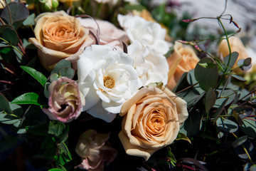 macro close up of wedding bouquet, flowers, roses and greenery in neutral colors