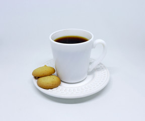 A cup of coffee and some tareco cookies