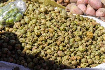 Green guasanas sold in the streets of a town