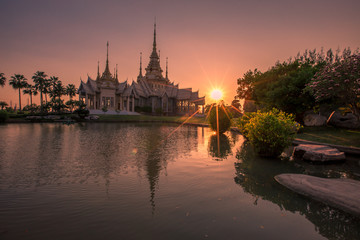 Fototapeta na wymiar Wallpaper Wat Lan Boon Mahawihan Somdet Phra Buddhacharn(Wat Non Kum)is the beauty of the church that reflects the surface of the water, popular tourists come to make merit and take a public photo