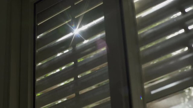 Window with electric shutters are being closed shut