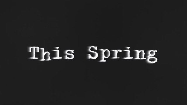 A scary text, This Spring, appearing on the screen with a light behind the typewriter font, typical of a horror flick (b-movie).