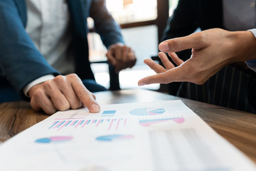 business people and coworker colleagues discussing explanations about week working plan project cooperating in modern coworking office.