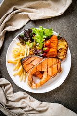 grilled salmon steak fillet with vegetable and french fries