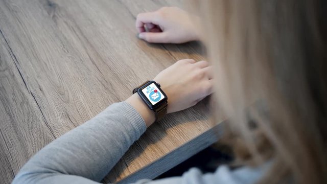 Smart Watch - Incoming Message on Screen - Over Shoulder - Slow Motion